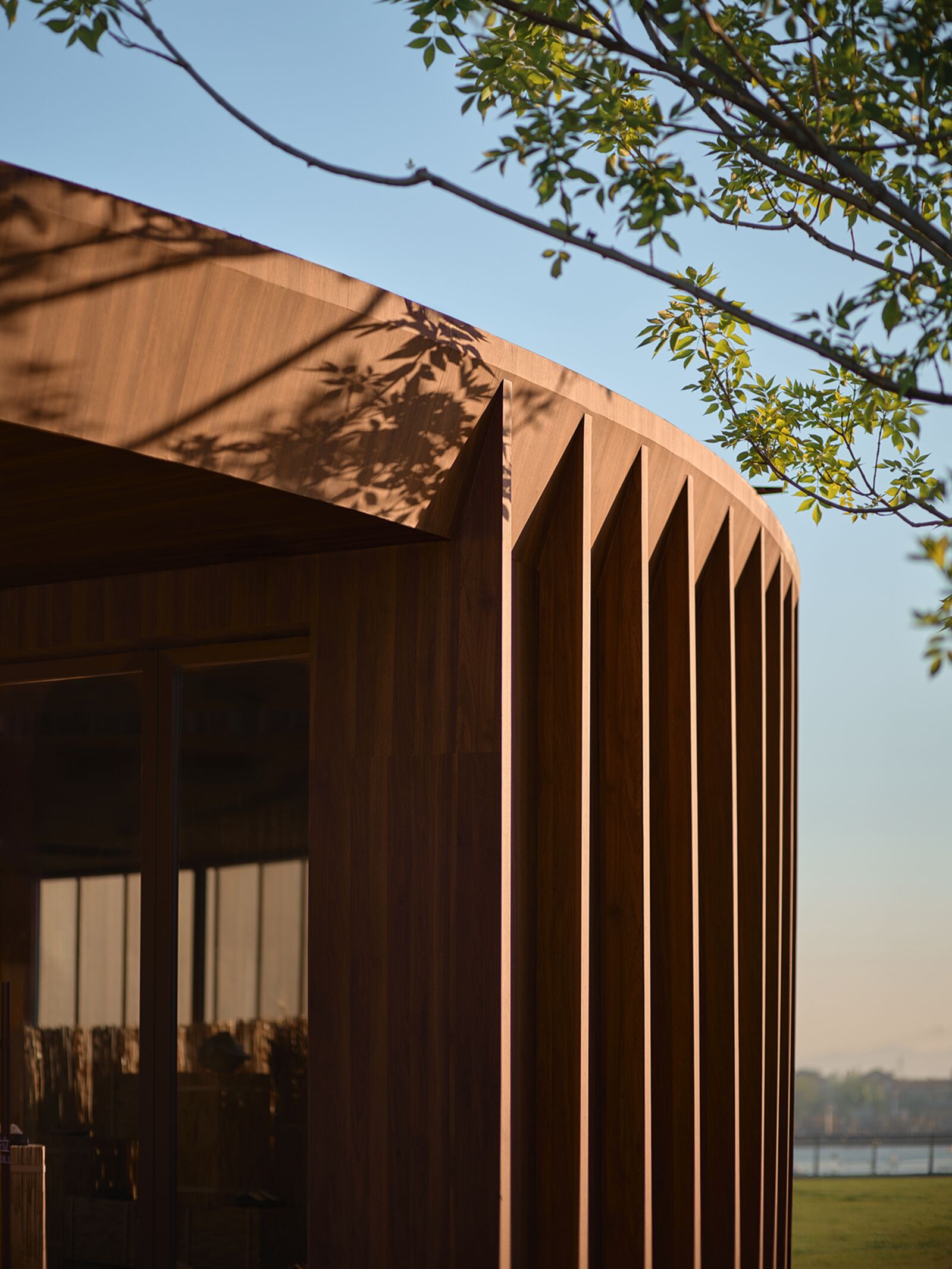 Wooden slat facade with natural shadows